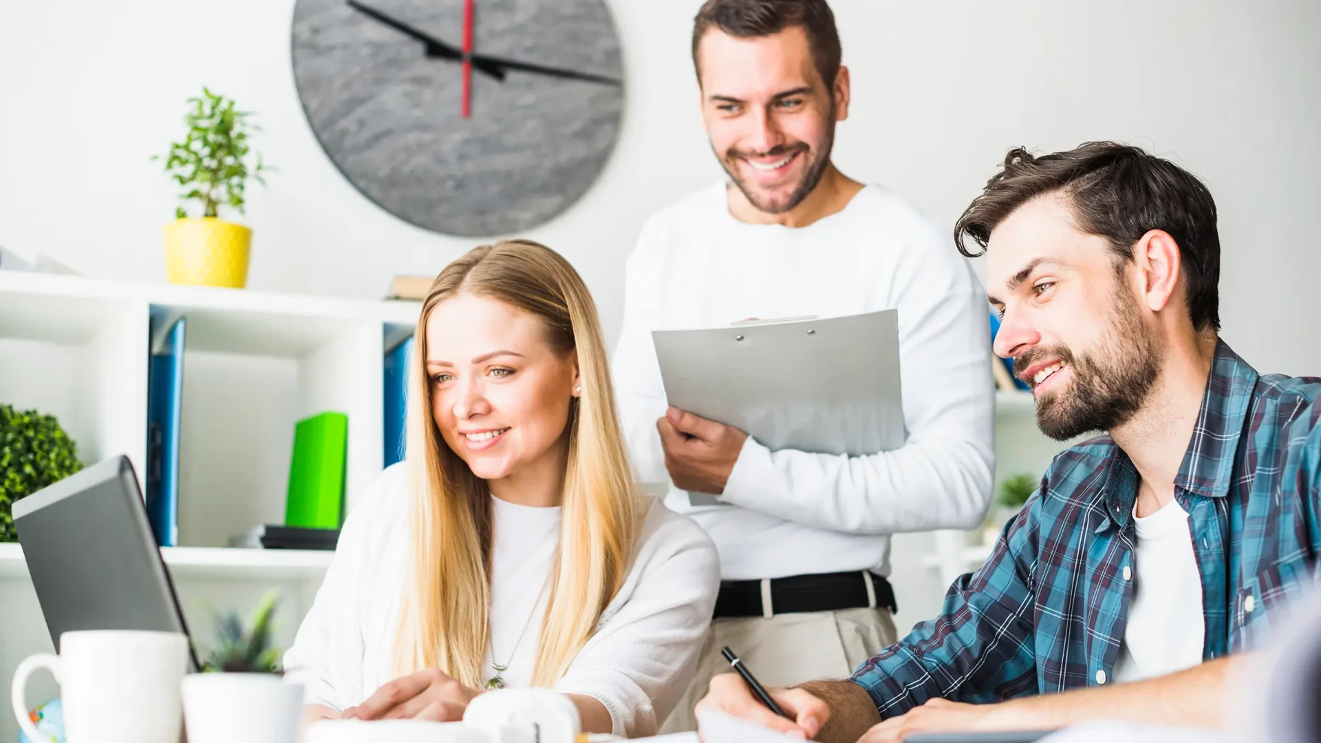 happy male female businesspeople working laptop